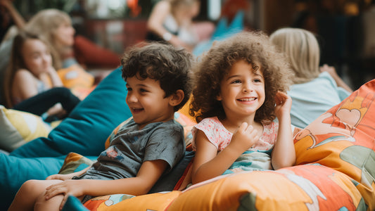 Two kids sitting on a bean bag chair