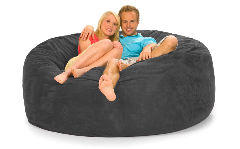A couple sitting on a 6 ft gray bean bag sold by Gigantic Bean Bags.