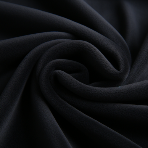 Scrunched up black bean bag cover material showing to quality of the microsuede