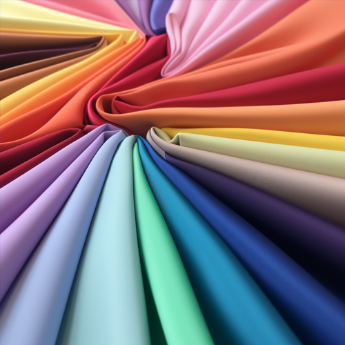 Microsuede fabric reams in a rainbow of colors spread out elegantly.