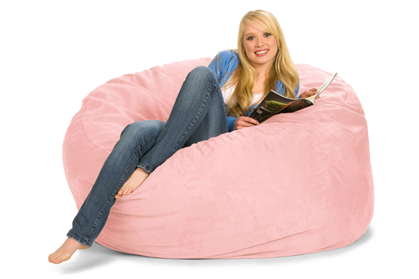 Girl reading on a big pink bean bag