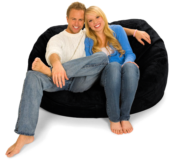 A man and woman sitting on a black 5 ft. Oval Lounger Bean Bag sold by Gigantic Bean Bags.