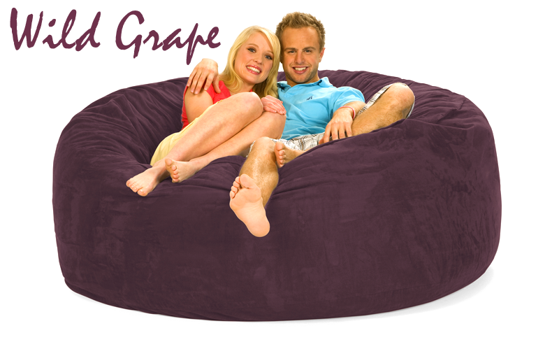 Wild Grape purple 6 ft Bean Bag Chair with a man and woman on it.