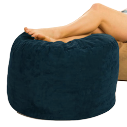 Bean Bag Ottoman in Navy Blue with a woman's legs resting on it with a white background.